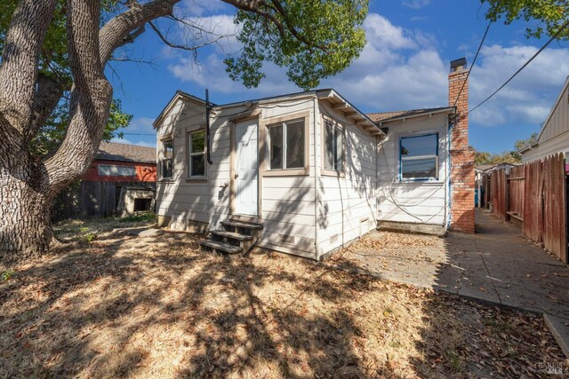 rear view of house with a patio