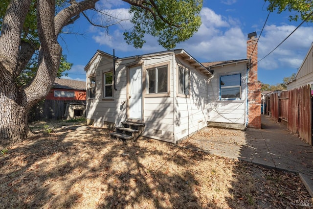 rear view of house with a patio