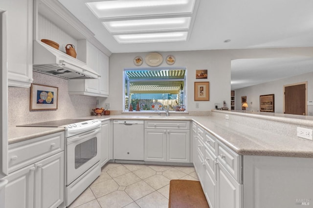 kitchen with kitchen peninsula, white cabinetry, and white appliances