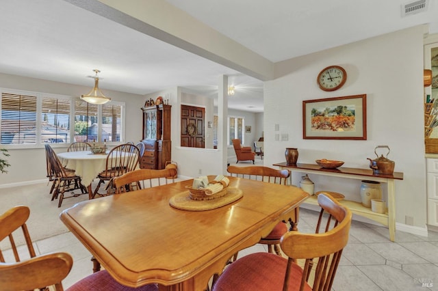 dining area featuring light tile patterned floors