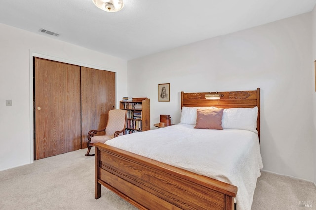 carpeted bedroom featuring a closet