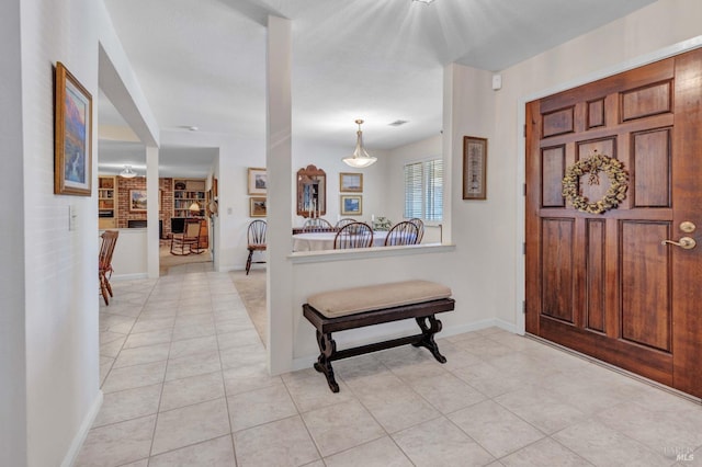 foyer featuring light tile patterned floors