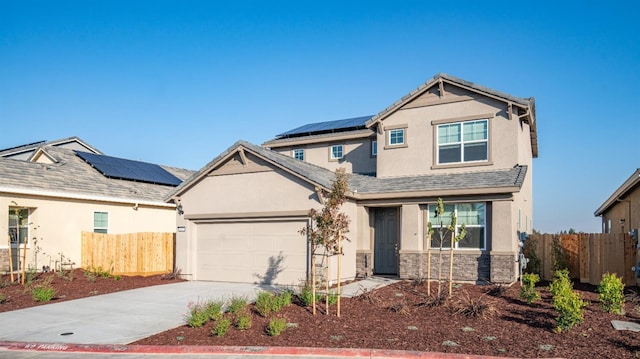 craftsman inspired home with a garage and solar panels