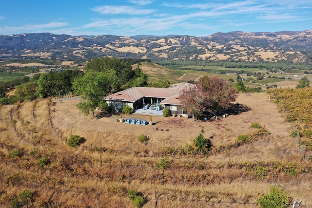 drone / aerial view with a mountain view and a rural view