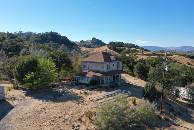 birds eye view of property with a mountain view