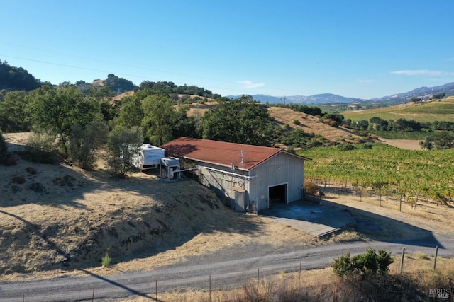 birds eye view of property with a rural view