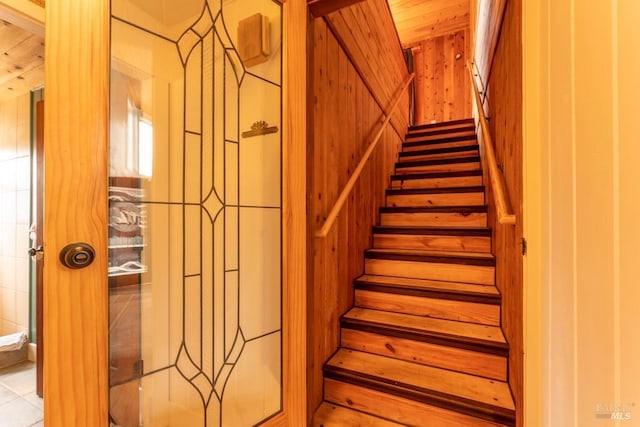 stairway featuring wood ceiling