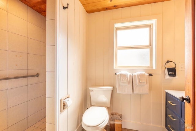 bathroom featuring vanity, toilet, and wooden ceiling