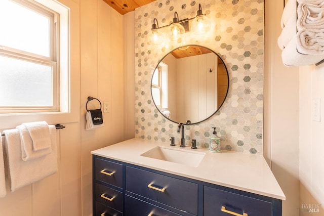 bathroom with plenty of natural light and vanity