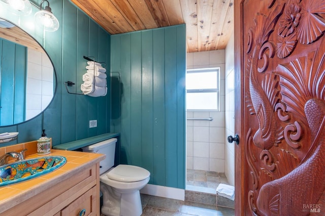 bathroom featuring tile patterned floors, toilet, wooden ceiling, and vanity