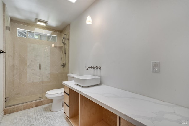 bathroom featuring toilet, walk in shower, and vanity