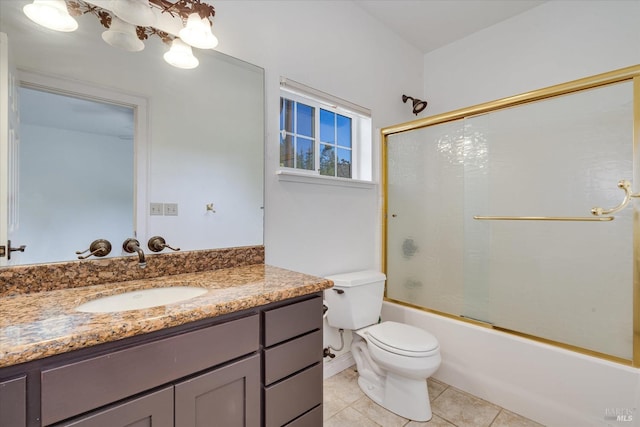 full bathroom with tile patterned floors, bath / shower combo with glass door, toilet, and vanity