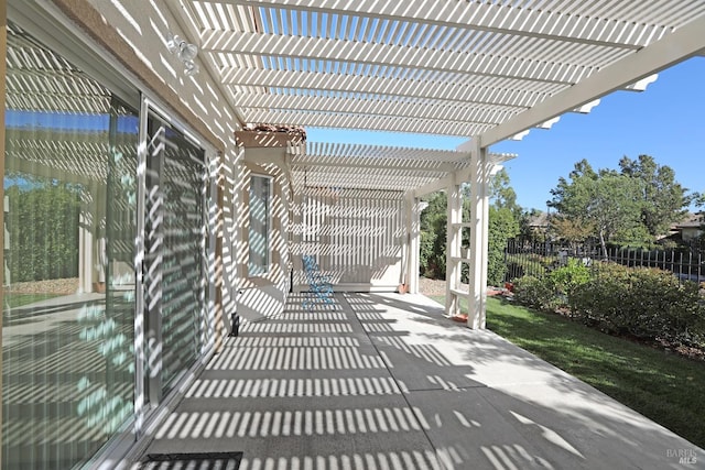 view of patio / terrace featuring fence and a pergola