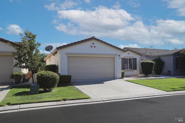 view of front of home with a garage, a tile roof, driveway, stucco siding, and a front lawn