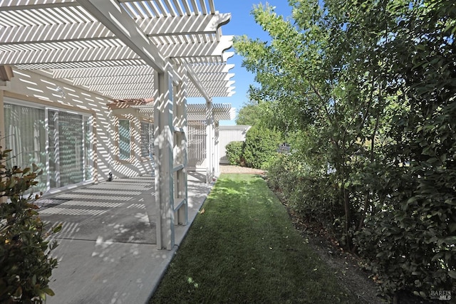 view of yard with a patio area and a pergola