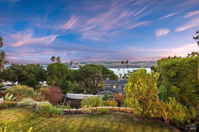 exterior space featuring a water and mountain view