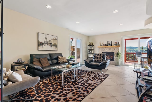 tiled living room with a wealth of natural light and a fireplace