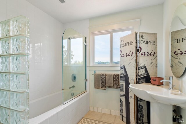 bathroom featuring tile patterned flooring, vanity, and a bathtub