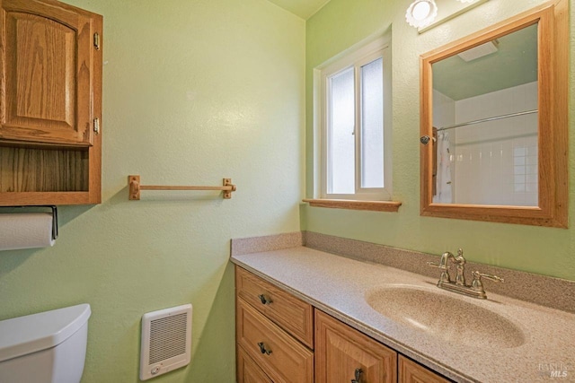 bathroom with curtained shower, toilet, heating unit, and vanity