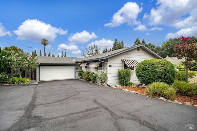 single story home featuring a garage