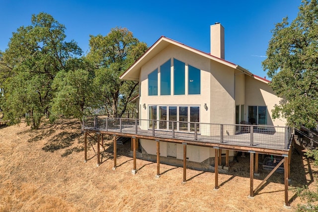 1280 W State Highway 20th St, Upper Lake, CA 95485 - back of house featuring stucco siding, a deck, and a chimney