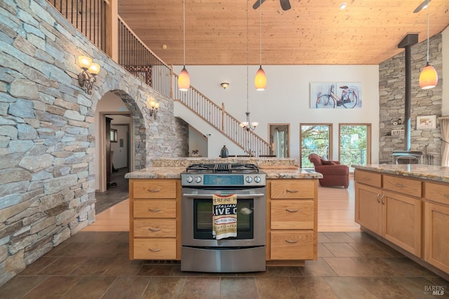 1280 W State Highway 20th St, Upper Lake, CA 95485 - kitchen featuring a towering ceiling, stainless steel range with gas cooktop, open floor plan, pendant lighting, and light brown cabinetry