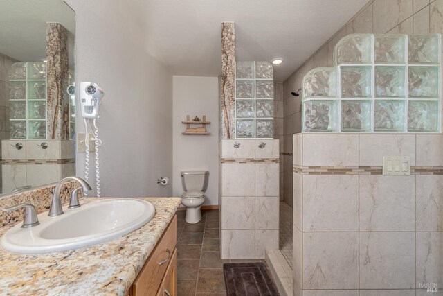 1280 W State Highway 20th St, Upper Lake, CA 95485 - bathroom with walk in shower, baseboards, toilet, vanity, and tile patterned flooring