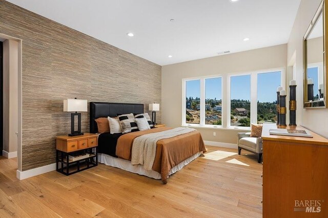 bedroom with light wood-type flooring