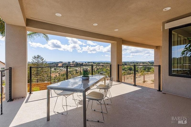 view of patio / terrace with a balcony