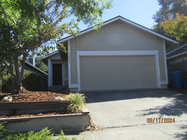 single story home featuring a garage