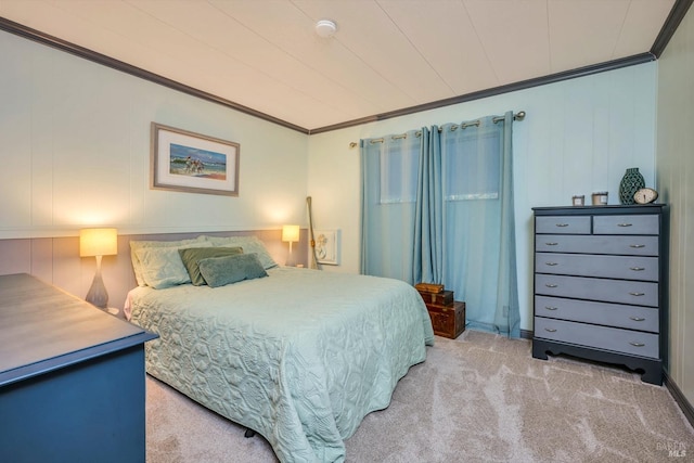 carpeted bedroom with ornamental molding