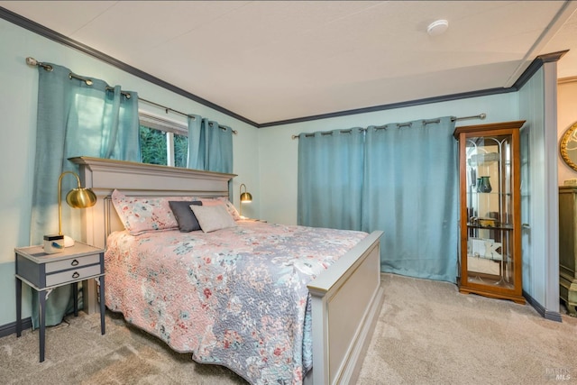 bedroom with ornamental molding and light carpet