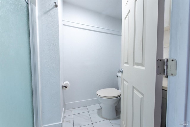 bathroom with tile patterned floors, toilet, and vanity