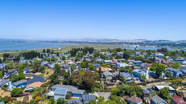 bird's eye view with a water and mountain view