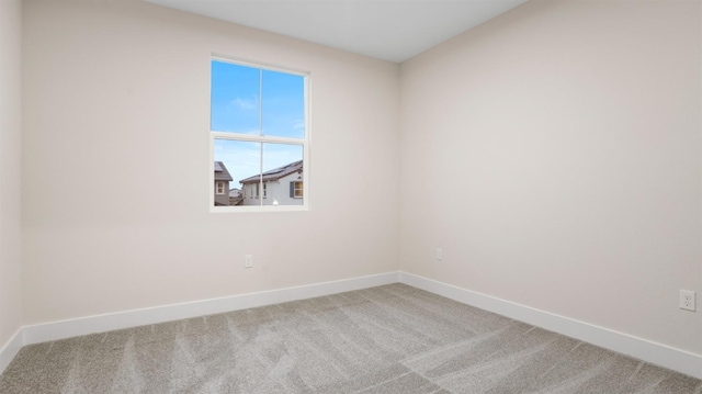 spare room with carpet floors