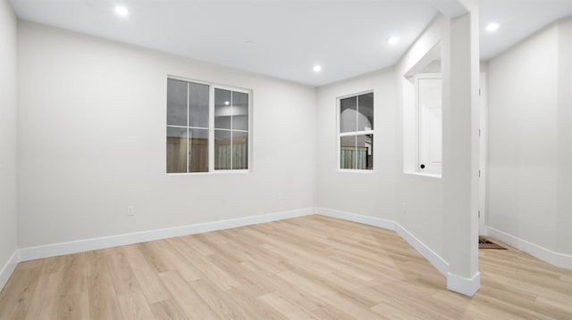 spare room featuring light hardwood / wood-style floors