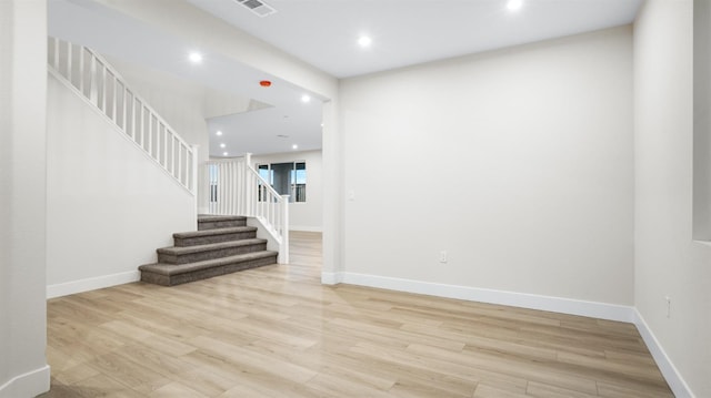 spare room with light hardwood / wood-style flooring