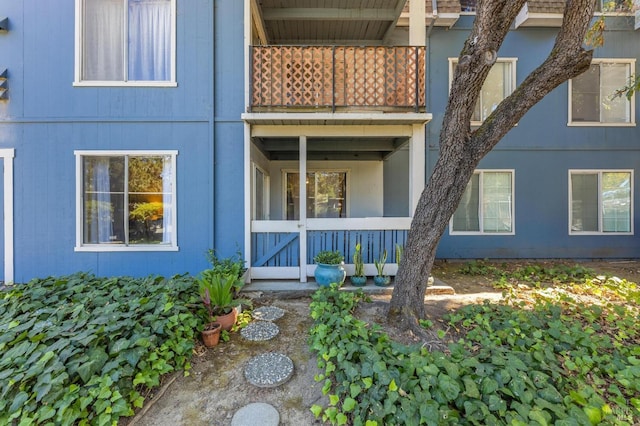 property entrance with a balcony