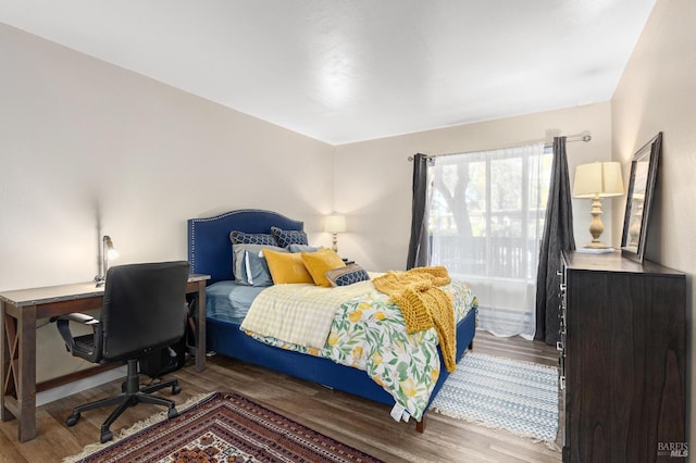 bedroom featuring hardwood / wood-style flooring