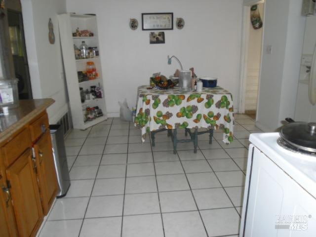 dining room featuring light tile patterned floors