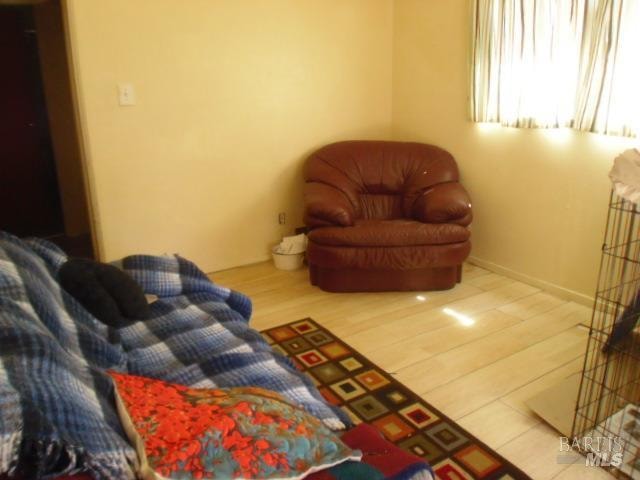 bedroom with hardwood / wood-style floors