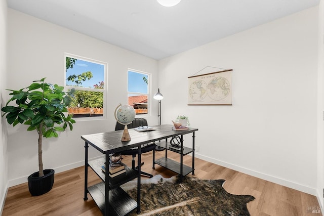 office area with hardwood / wood-style floors