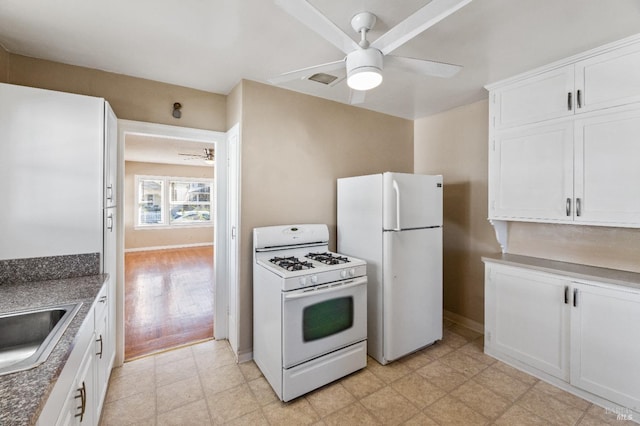 kitchen with ceiling fan, sink, white cabinets, and white appliances