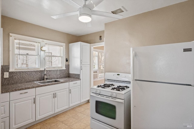 kitchen with ceiling fan, sink, white cabinets, and white appliances