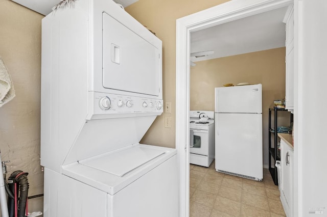 clothes washing area with stacked washer / dryer