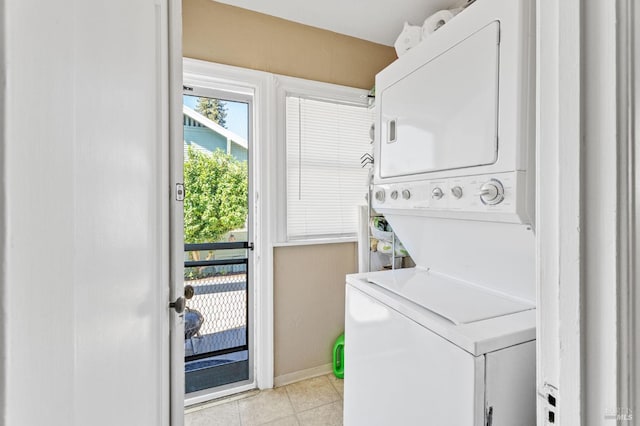 laundry area featuring stacked washer / drying machine