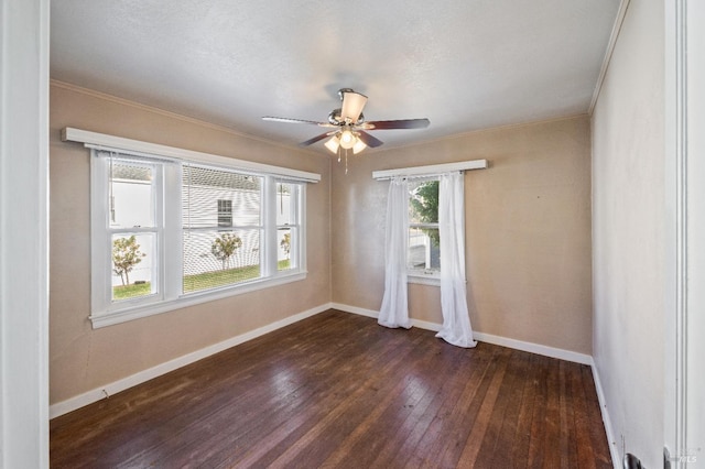 spare room with ceiling fan, ornamental molding, and dark hardwood / wood-style flooring