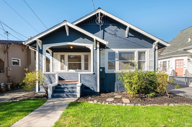 bungalow with a front yard