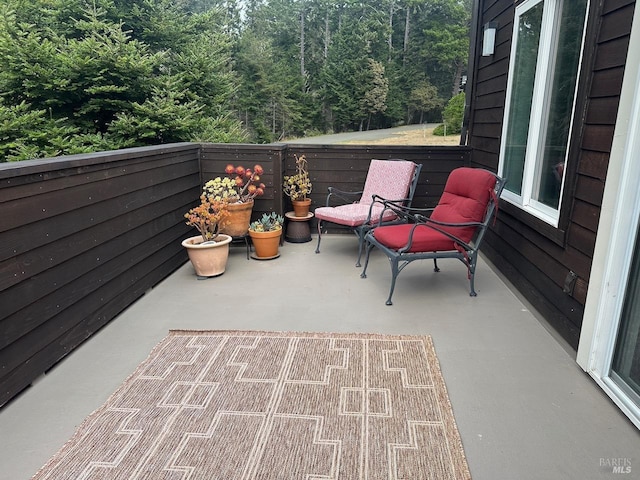 view of patio featuring a balcony