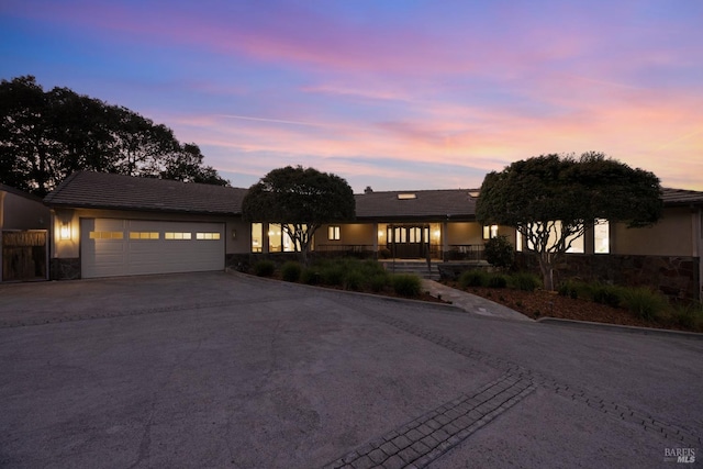 prairie-style home featuring a garage